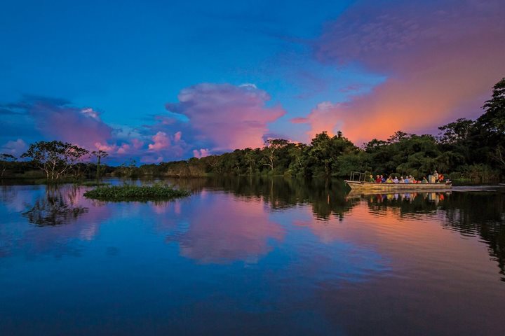 A skiff on the Amazon River at dawn