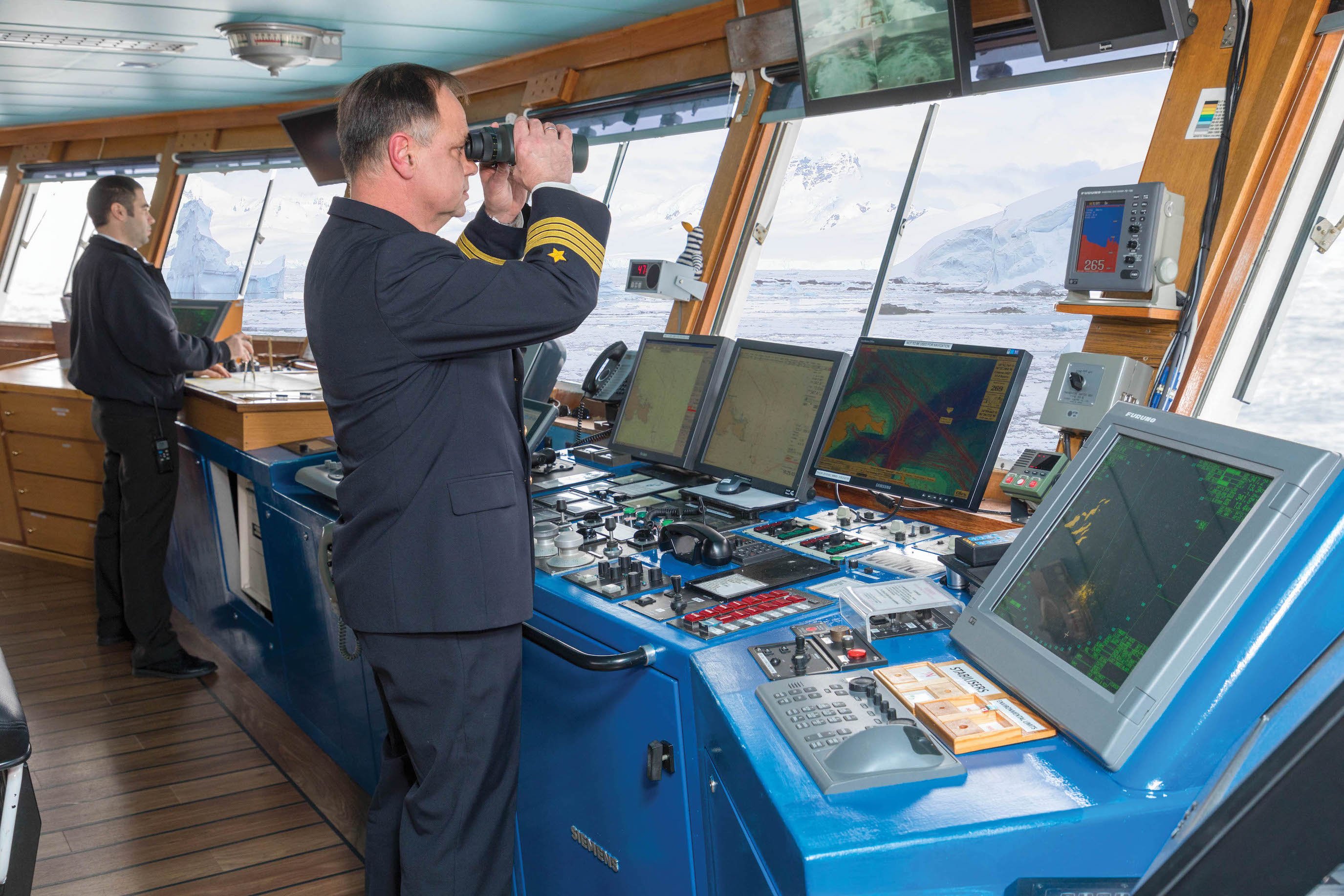 Captain on the Bridge scanning the ocean