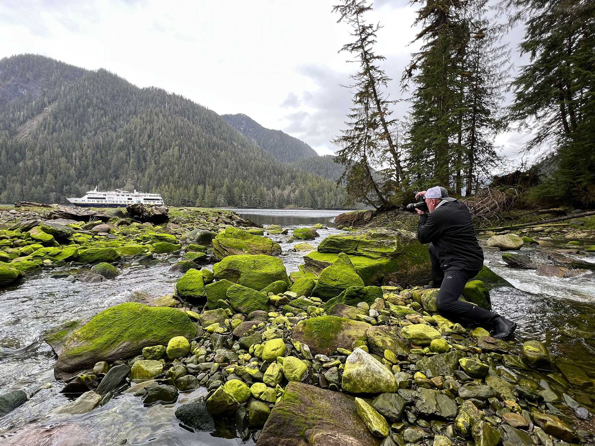 photographer takes picture of landscape