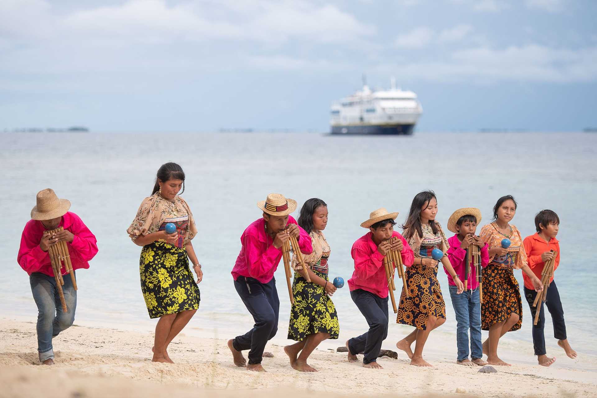 Guna dancers in front of National Geographic Quest