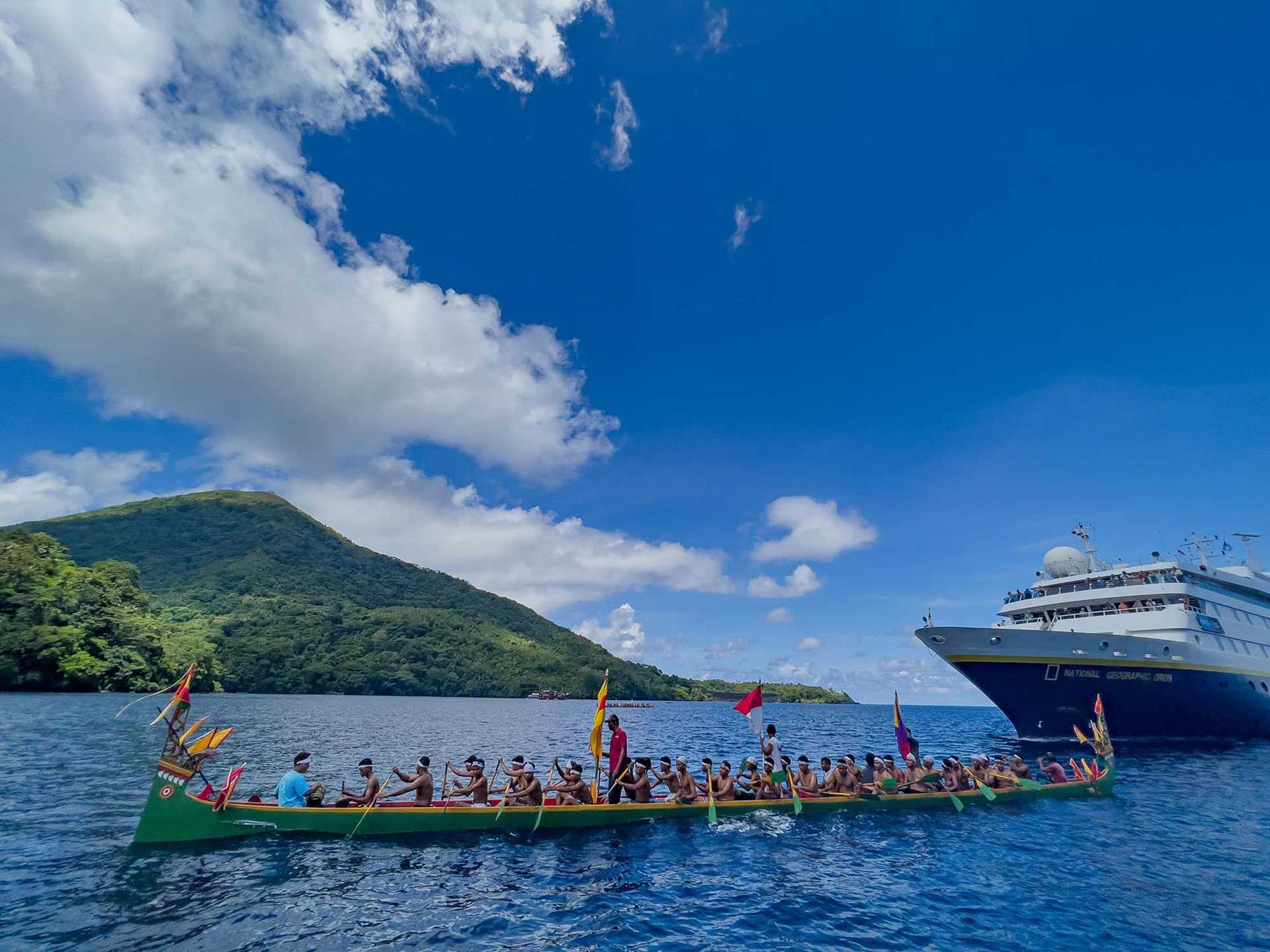 indonesian canoes greeting the national geographic orion ship